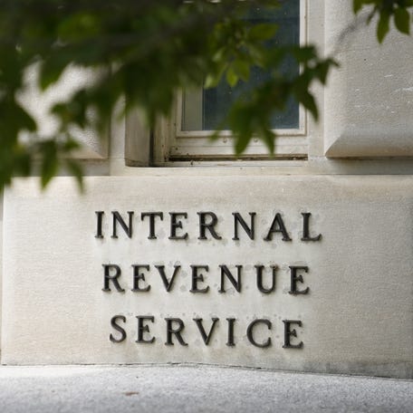 Taxpayers are warned that their income tax refund could be smaller this year after many stimulus tax breaks ended. FILE - A sign outside the Internal Revenue Service building in Washington, on May 4, 2021. (AP Photo/Patrick Semansky, File)