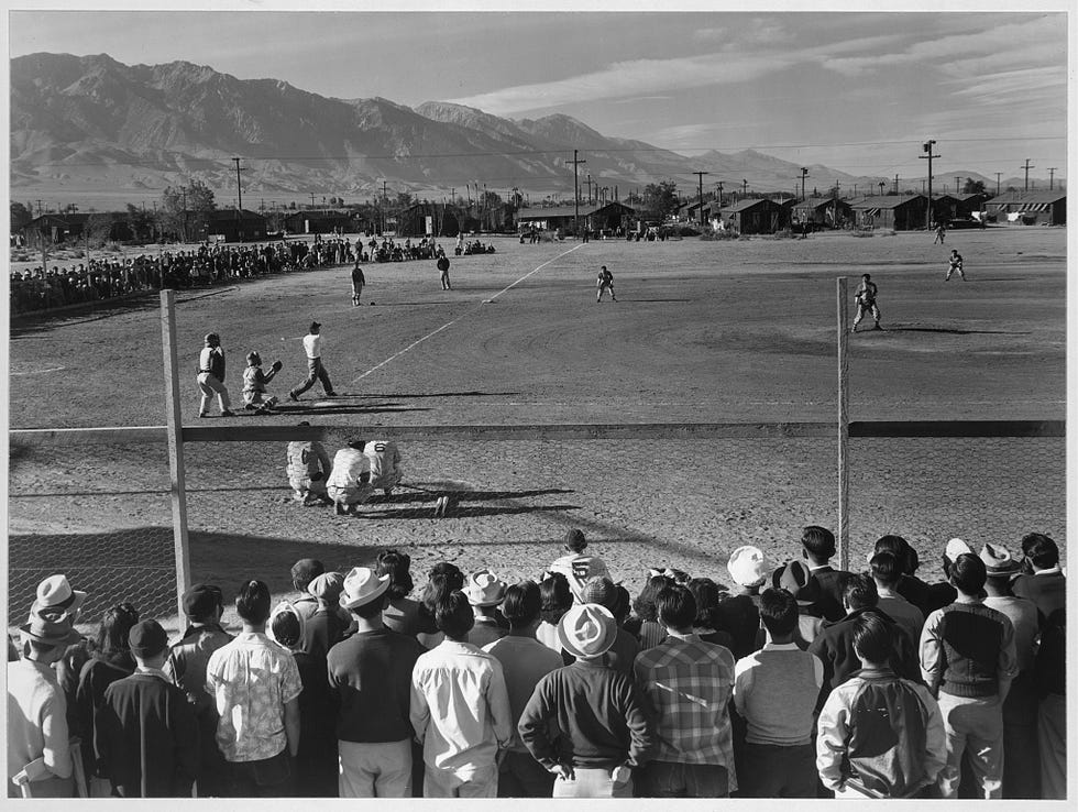 Japanese incarceration in the United States in Adams’ photos 8 An amateur baseball game in progress at the Japanese-American mass incarceration camp.