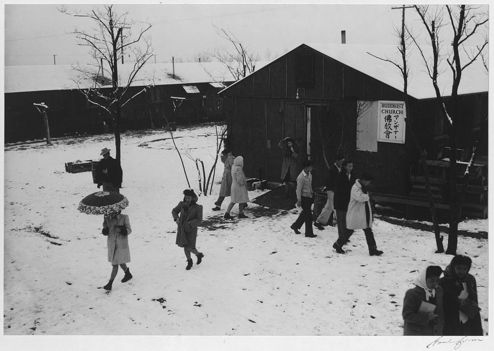Japanese incarceration in the United States in Adams’ photos 21 People leaving Buddhist church in winter.