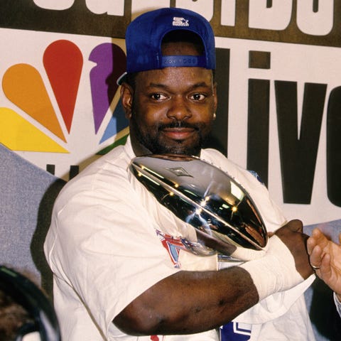 Emmitt Smith holds the Lombardi Trophy after the C