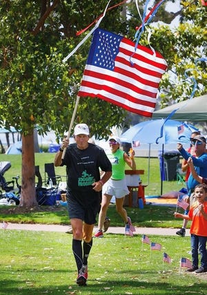 Mike Rouse runs his annual "31 For 31" event in 2021, running 31 miles a day for 31 days to honor 31 U.S. military men who were killed in a helicopter crash in Afghanistan. Rouse, 70, will run his 262nd and final marathon Sunday in the 26.2-mile Austin Marathon.