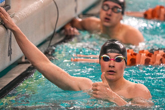 Lubbock swimmer Jones Lambert gives a thumbs up to his coach after competing in the boys 200 yard freestyle during the class 5A UIL Swimming and Diving Championship Preliminaries at the Lee and Joe Jamail Texas Swimming Center on Friday, Feb. 17, 2023 in Austin.