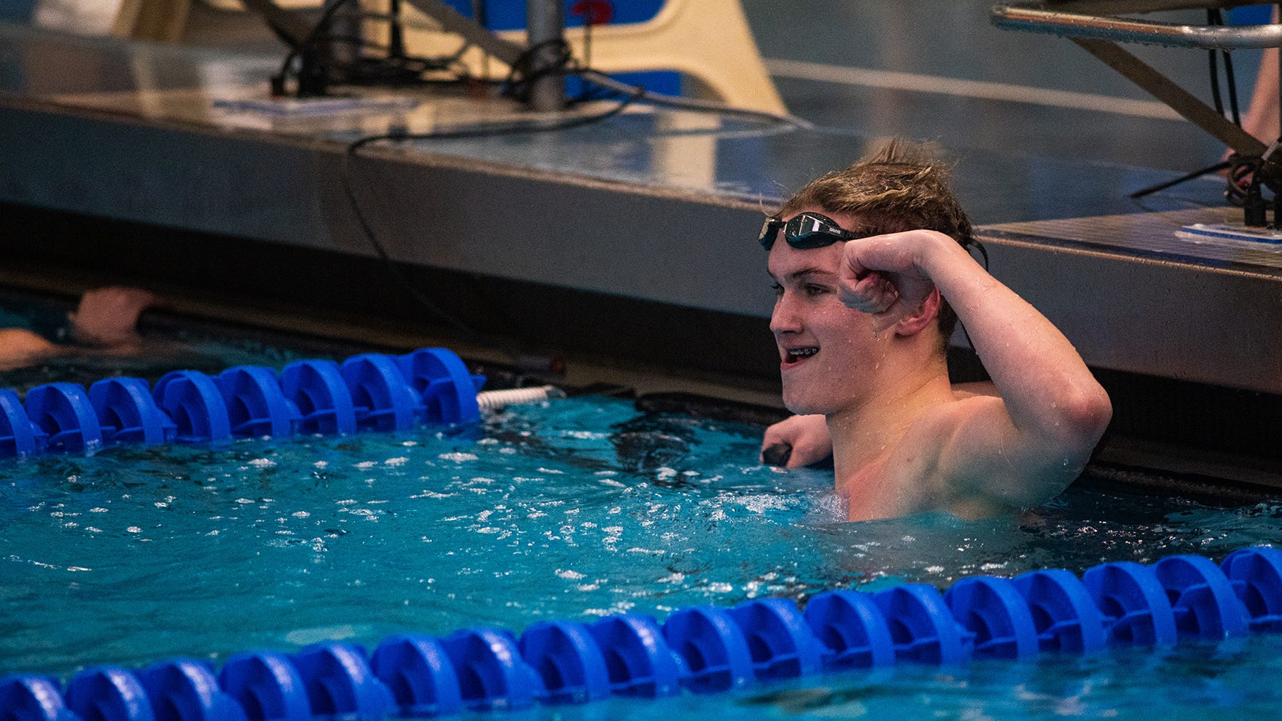 Pine Bush's Tomek Oakes flexes after competing in the second heat of the boys 100 yard freestyle race during the Section 9 boys swimming championships in Montgomery, NY on Saturday, February 18, 2023. Pine Bush's Tomek Oakes won the heat. KELLY MARSH/FOR THE TIMES HERALD-RECORD