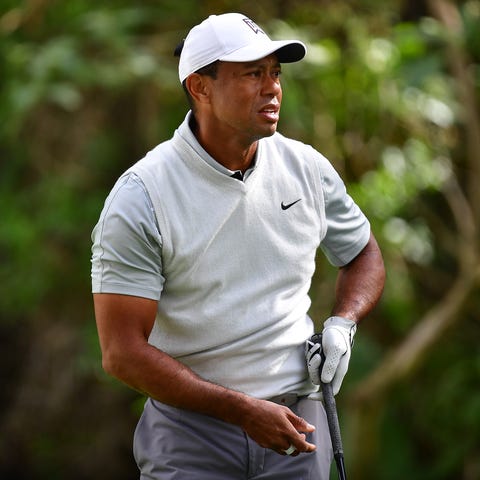 Tiger Woods hits from the 12th tee during the thir