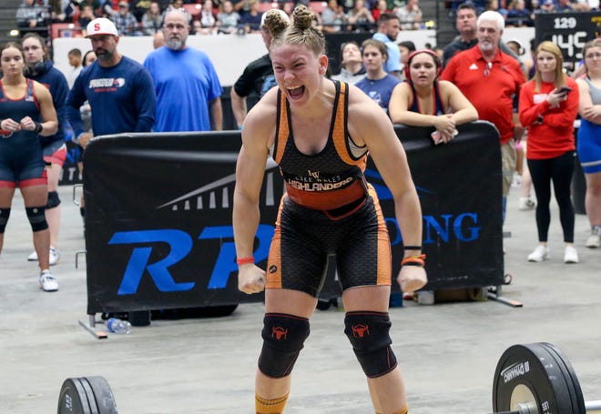 Lake Wales senior Kayden Arliss reacts after setting a personal record on the snatch on Saturday at the 2023 FHSAA Girls Weightlifting State Meet at The RP Funding Center.