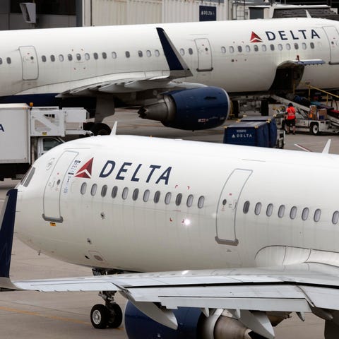 A Delta Air Lines plane leaves the gate on July 12