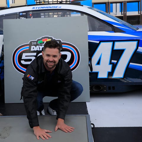 Ricky Stenhouse Jr. places his hand inn cement at 