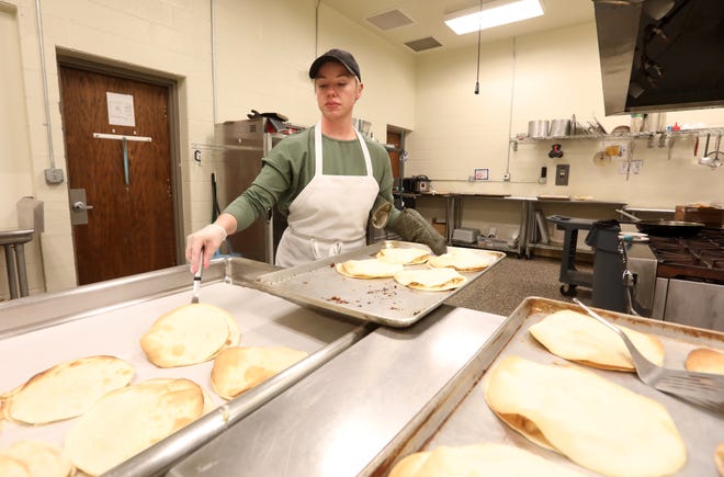 Bre Pye prepares quesadillas for her meal prep service, Fit Meal Prep, at the Foodworks Alliance kitchen in Zanesville.