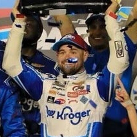 Ricky Stenhouse hoists the Harley J. Earl trophy a