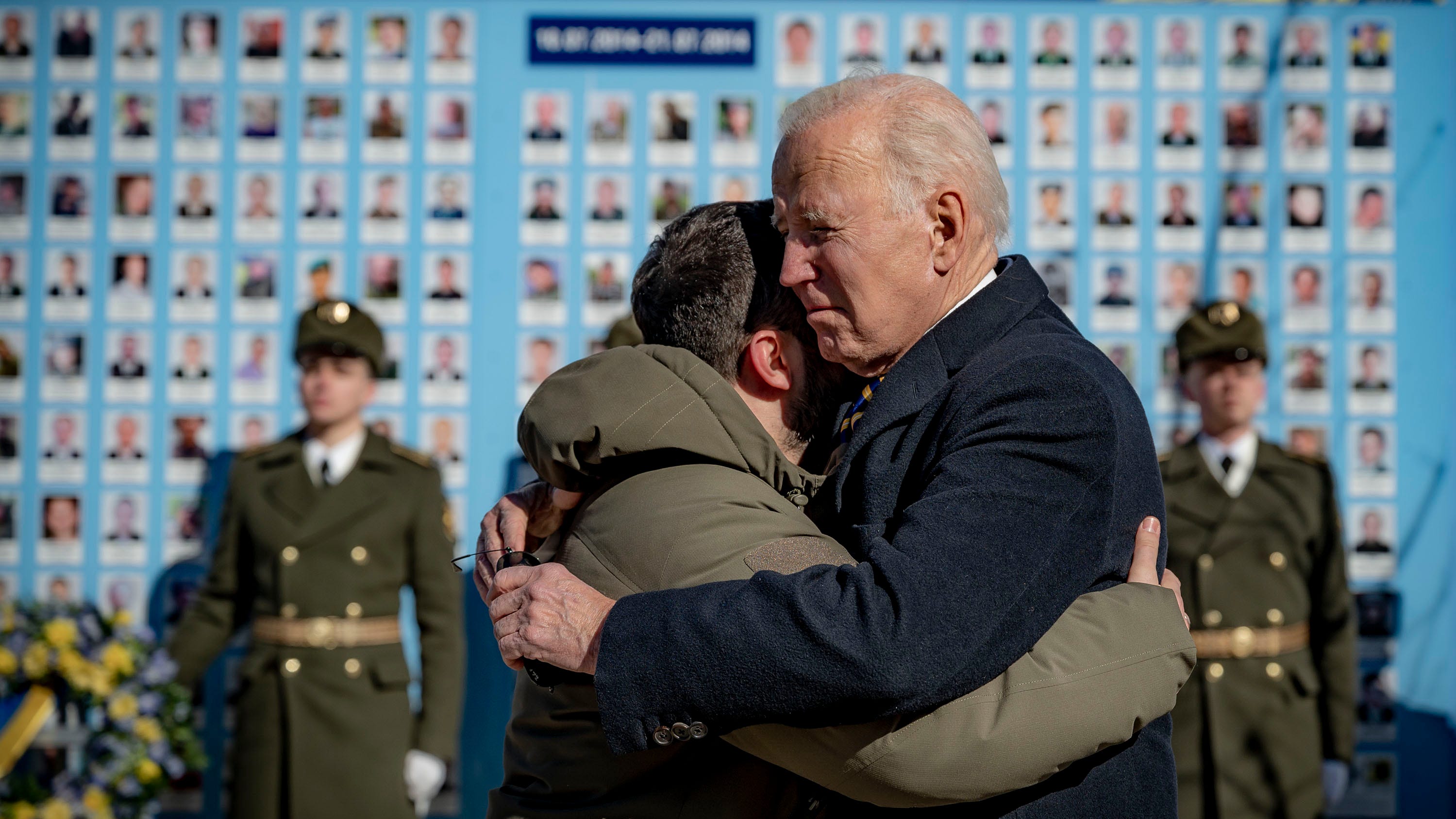 President Joe Biden and Ukrainian President Volodymyr Zelenskyy hug goodbye at the memorial wall of fallen soldiers in Kyiv on Feb. 20, 2023.