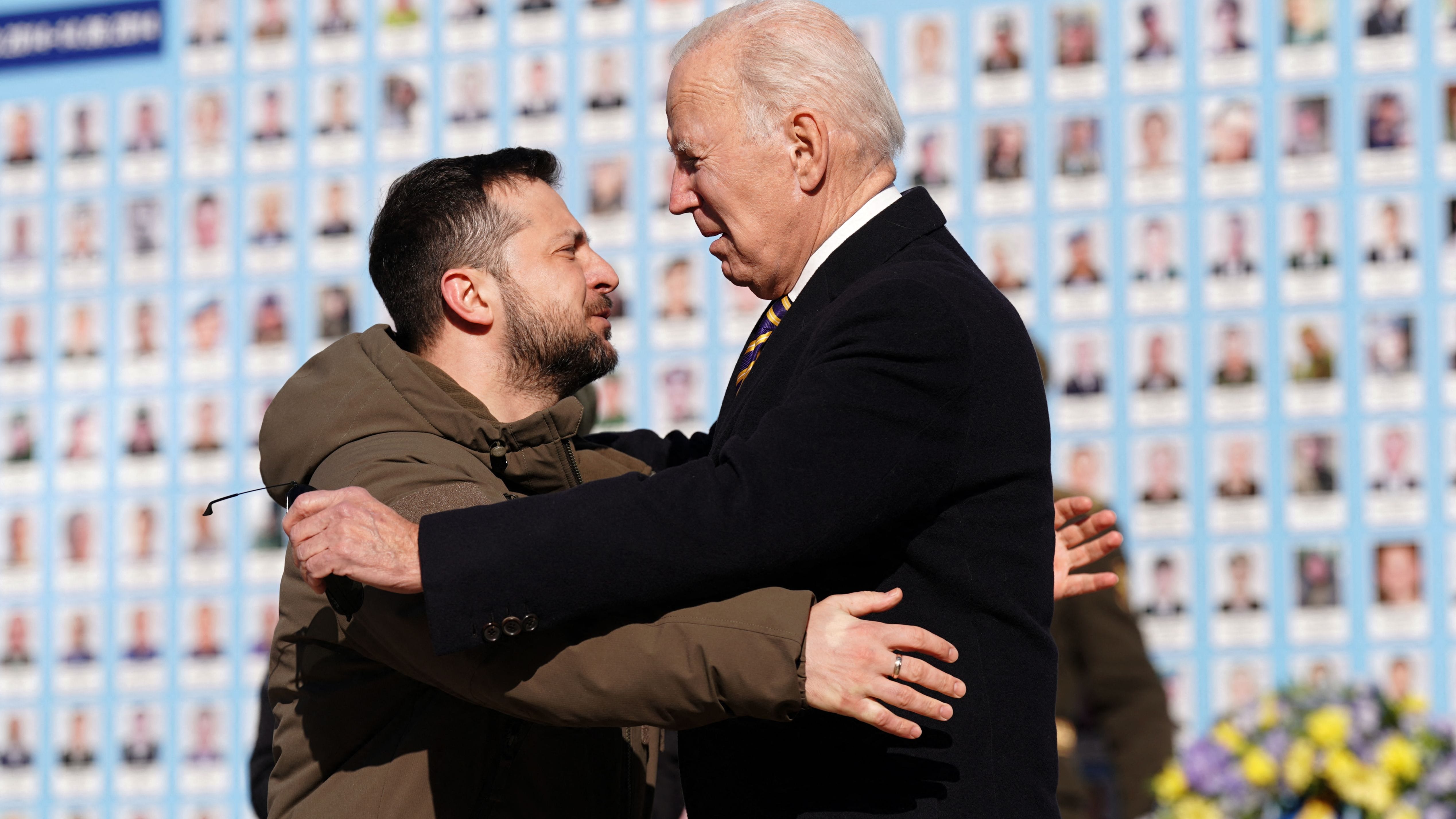 US President Joe Biden (R) is greeted by Ukrainian President Volodymyr Zelensky (L) during a visit in Kyiv on February 20, 2023.