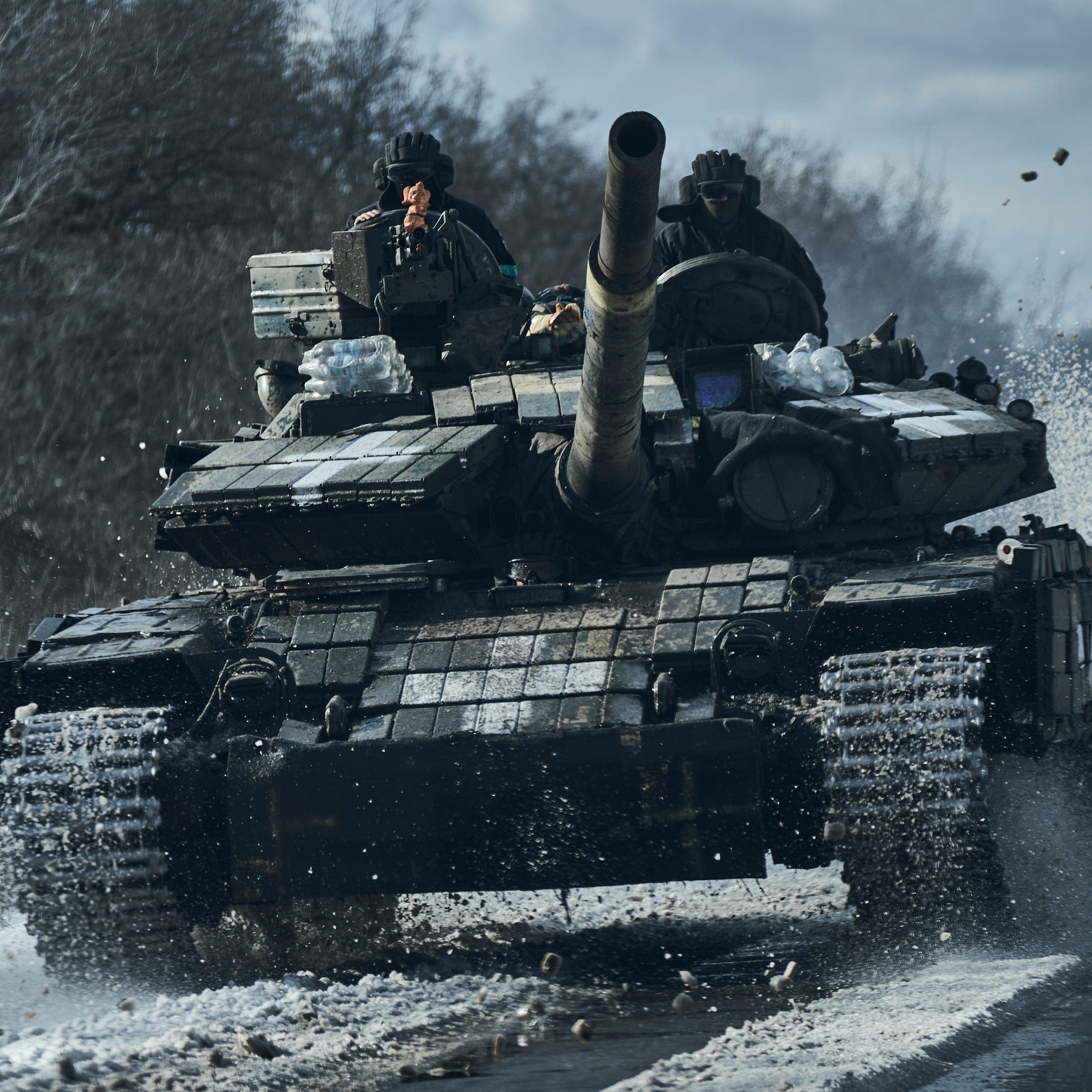 Ukrainian soldiers ride atop a tank in the frontline in Bakhmut, Donetsk region, Ukraine, Monday, Feb. 20, 2023.