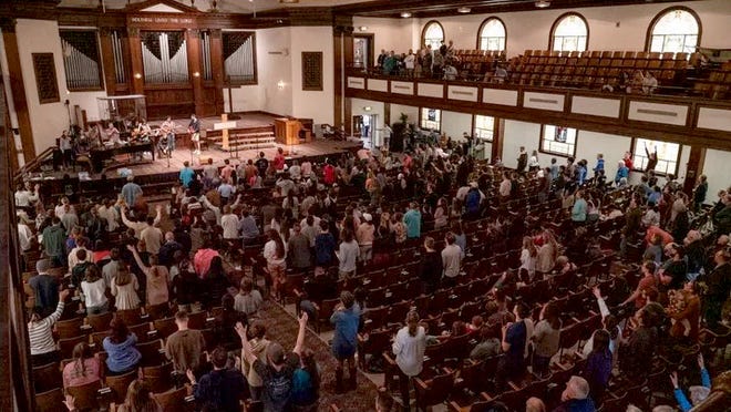 Worshippers at Hughes Auditorium at Asbury University in Wilmore, Kentucky, participate in what grew into the 2023 Asbury revival.