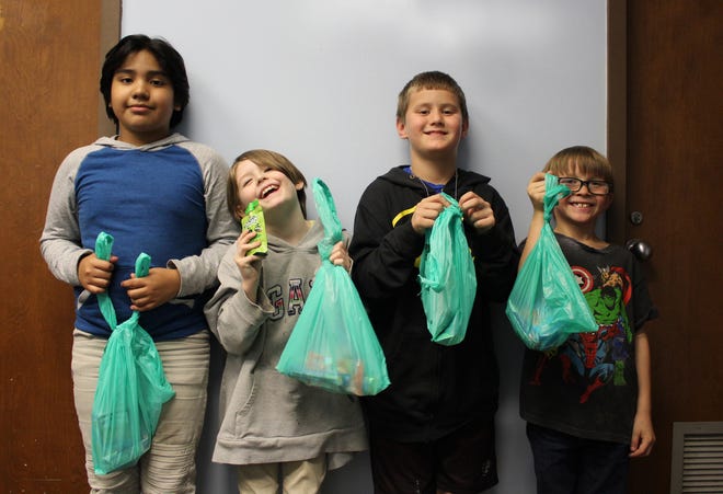 Thanks to All Faiths Food Bank, youngsters don't go hungry on weekends or during school breaks. They get a bag of food to take home.