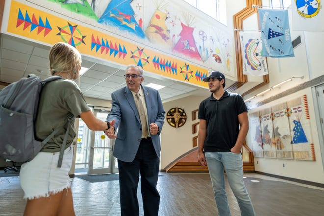 South Dakota State University President Barry Dunn greets students inside the American Indian Student Center on campus. Part of the Wokini Initiative’s funding went toward the construction of the center.