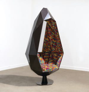 This steel pod chair garnered extra interest from collectors due to its upholstery - a graffiti version of the Declaration of Independence designed by Stephen Sprouse for Knoll.