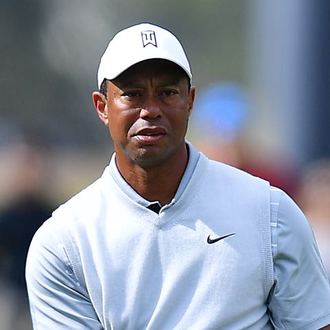 Tiger Woods watches his shot from the fairway to t