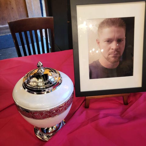A photo of Richard Ward and an urn with his ashes 