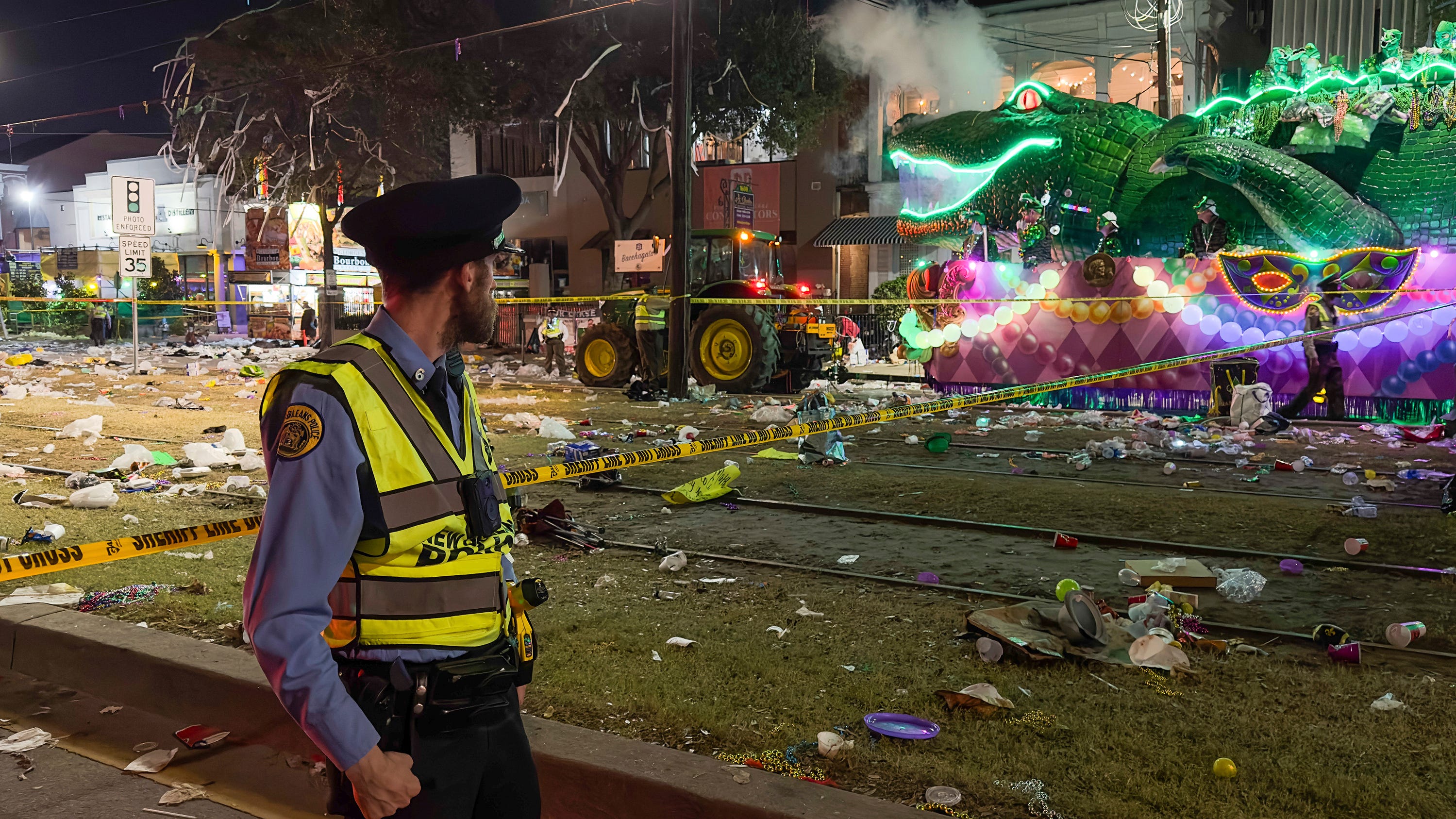 Police work the scene of a shooting at the Krewe of Bacchus parade on Sunday, Feb. 19, 2023.  Five people were shot, including a young girl, during a Mardi Gras parade in New Orleans, police said, and a suspect was in custody.