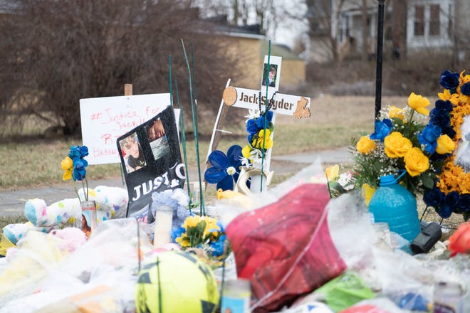 Flowers, candles, and other mementos left near Capital Avenue honoring 17-year-old Jack Snyder are shown Wednesday, Feb. 22, 2023.