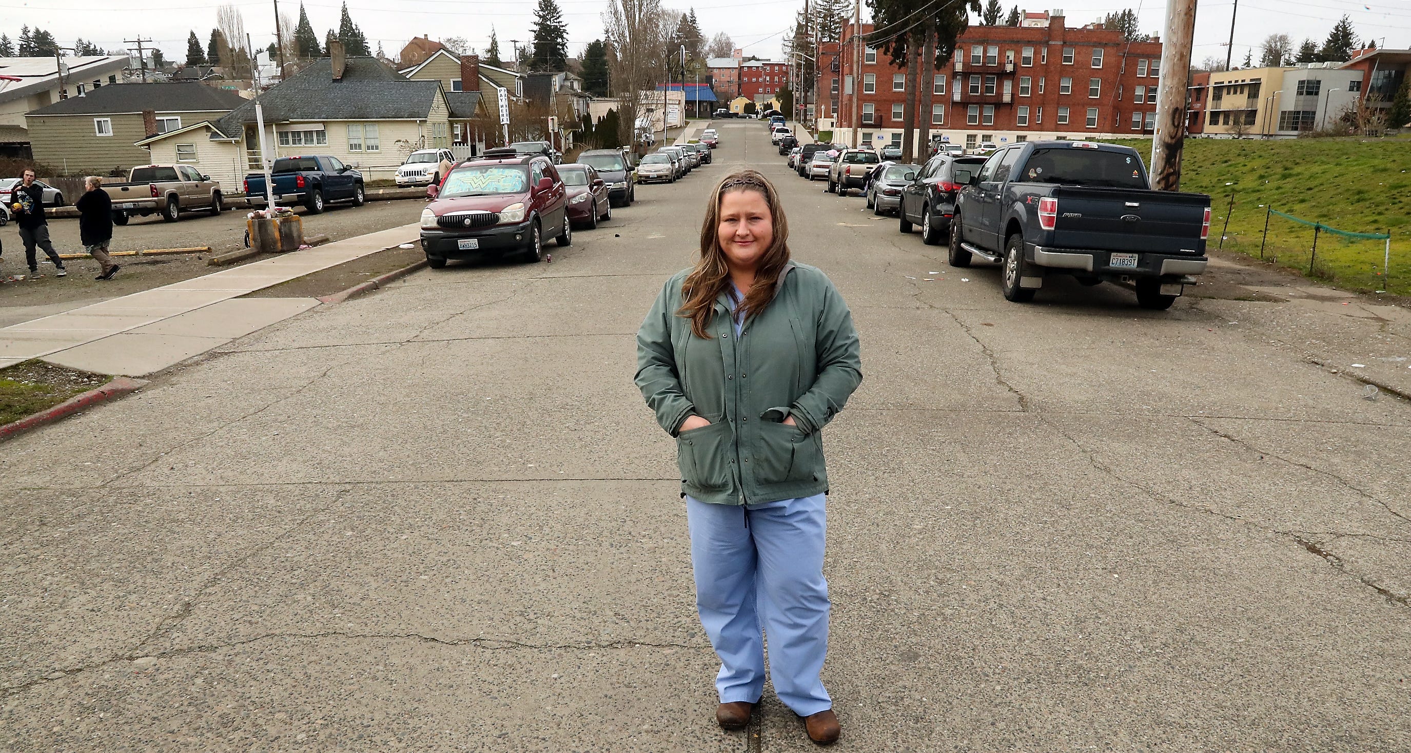 Kimmy Siebens poses for a portrait in the middle of Dr. ML King Way in Bremerton where she does a lot of her outreach with the homeless population, on Wednesday, Feb. 22, 2023.