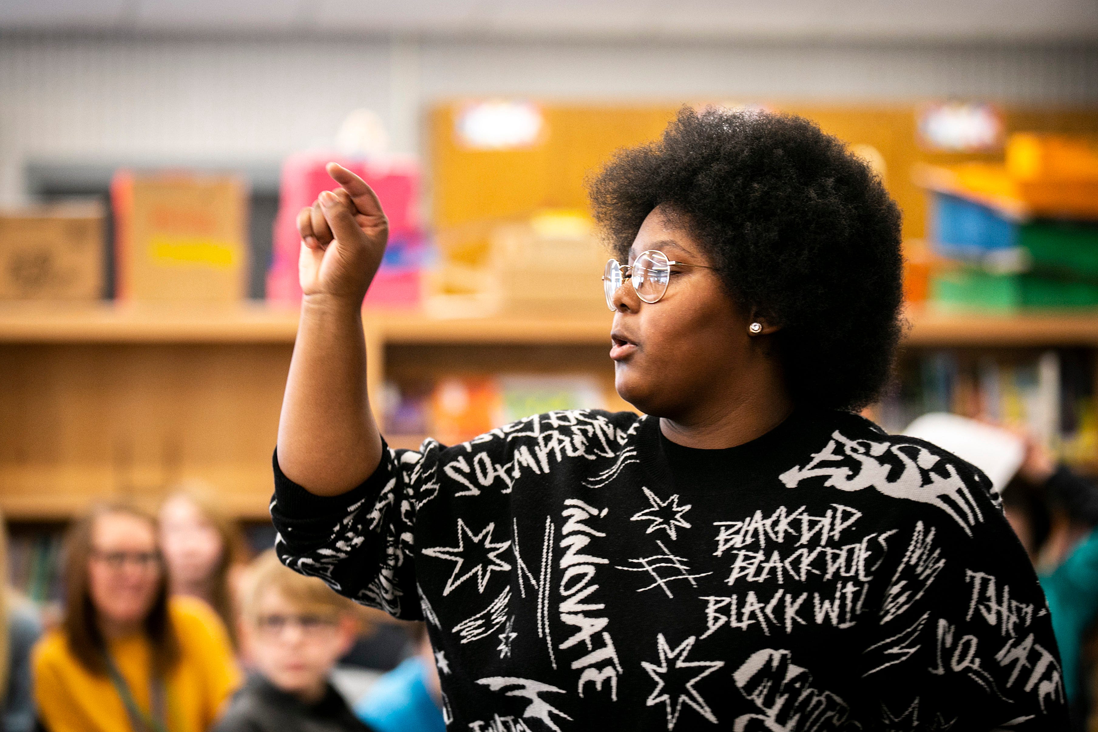 Dasia Taylor talks with fifth and sixth grade students, Tuesday, Feb. 21, 2023, at Shimek Elementary School in Iowa City, Iowa.
