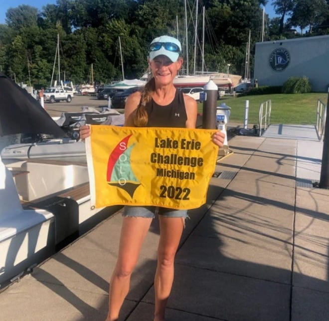 Amy Stout is shown after completing the Lake Erie Solo Challenge.
