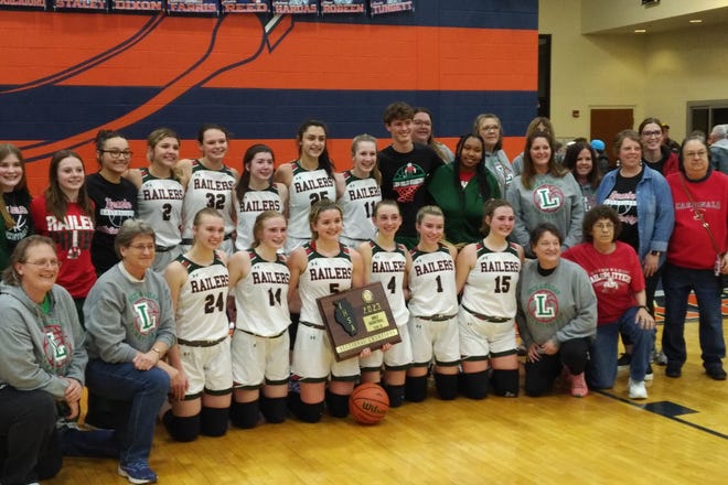 Lincoln players and fans pose with the Class 3A Rochester Sectional championship plaque minutes after Lincoln beat Rochester 53-23 on Thursday at the Rochester Athletic Complex. Lincoln won its fifth sectional title in program history and the first since 2016.