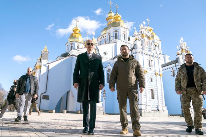 President Joe Biden walks with Ukrainian President Volodymyr Zelensky during a surprise visit at St. Michael's Golden Dome Cathedral in Kiev, Monday, February 20, 2023.