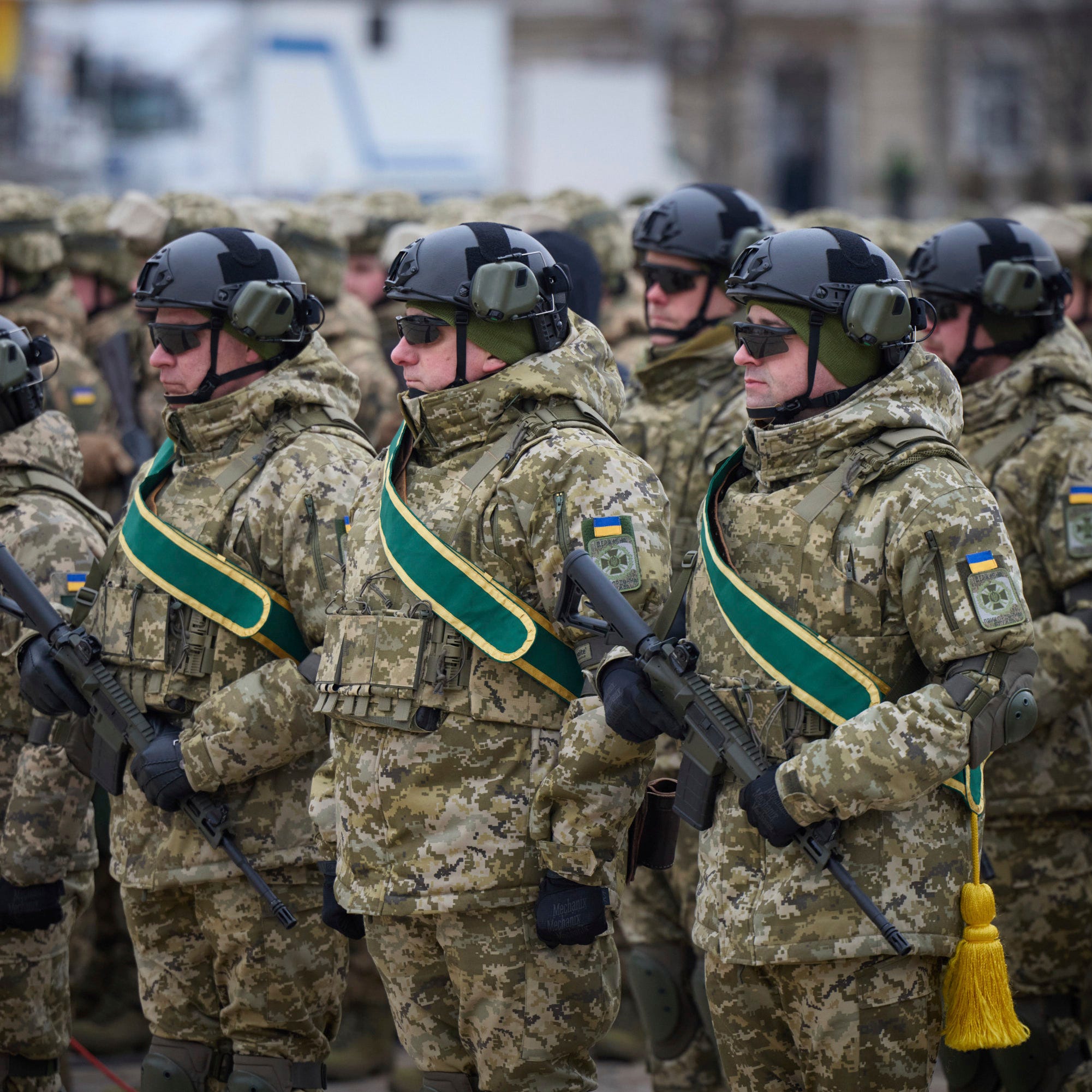 Ukrainian soldiers line up during a commemorative event on the one-year anniversary of the war with Russia in Kyiv, Ukraine, Friday, Feb. 24, 2023.