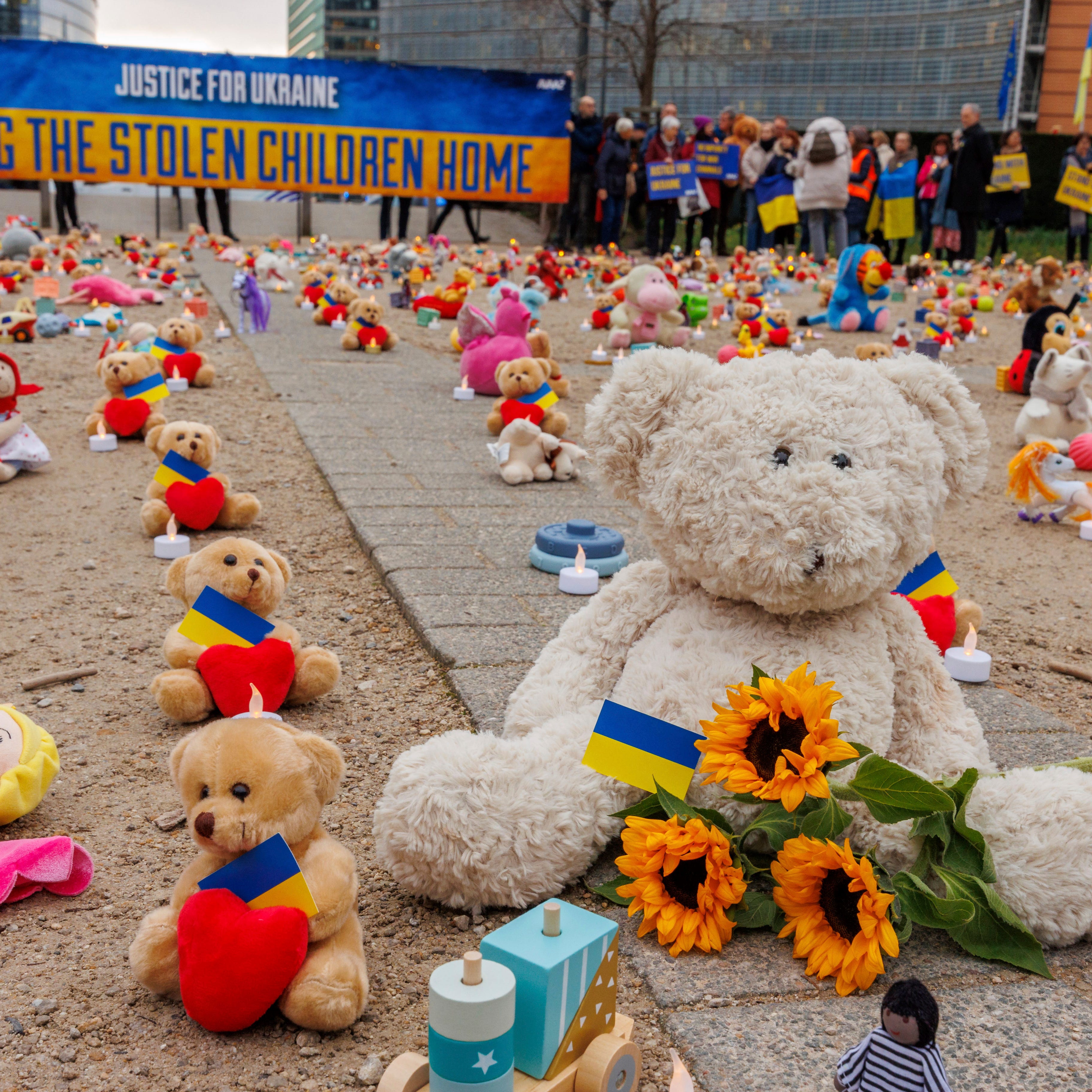 IMAGE DISTRIBUTED FOR AVAAZ.ORG - Avaaz members and Ukrainian refugees install thousands of kids' teddy bears and toys at Schuman Roundabout in front of the European Commission to highlight the reported abduction of thousands of Ukrainian children by Russia on Thursday, Feb 23, 2022 in Brussels. Attendants call on EU, US, UK and Canadian leaders to sanction 14 Russian officials who are among those allegedly responsible for the abductions. (Olivier Matthys/AP Images for   Avaaz.org) ORG XMIT: OM112