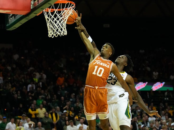 Texas' Jabari Rice is fouled by Baylor's Jonathan Tchamwa Tchatchoua in the first half of the Bears' 81-72 win Saturday at the Ferrell Center in Waco. The loss was a costly one for the Longhorns, who are trying to keep pace with Kansas atop the Big 12 standings.