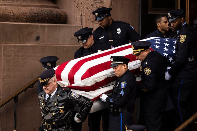A honor guard carries the casket containing the remains of Temple University Police Officer Christopher Fitzgerald from the Cathedral Basilica of Saints Peter and Paul in Philadelphia, Friday, Feb. 24, 2023. Fitzgerald was killed in the line of duty on Saturday, Feb. 18. He was 31.