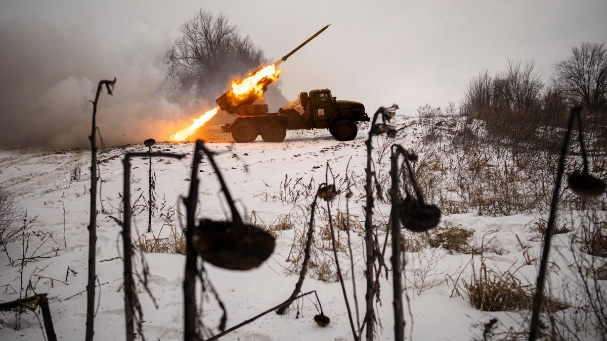 Ukrainian military fires from a multiple rocket launcher at Russian positions in the Kharkiv area, Ukraine, Saturday, Feb. 25, 2023. The Biden administration declared its Ukraine solidarity with fresh action as well as strong words on Friday, piling sweeping new sanctions on Moscow and approving a new $2 billion weapons package to re-arm Kyiv a year after Russia's invasion.