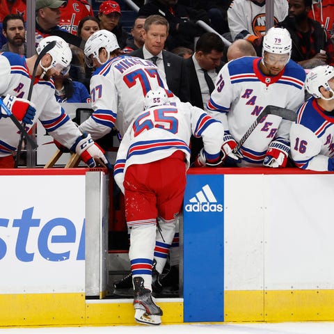 New York Rangers defenseman Ryan Lindgren (55) lea