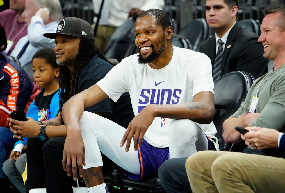 Phoenix Suns forward Kevin Durant (35) visits with the fans during the pregame warm-ups against the Oklahoma City Thunder at Footprint Center in Phoenix on Feb. 24, 2023.