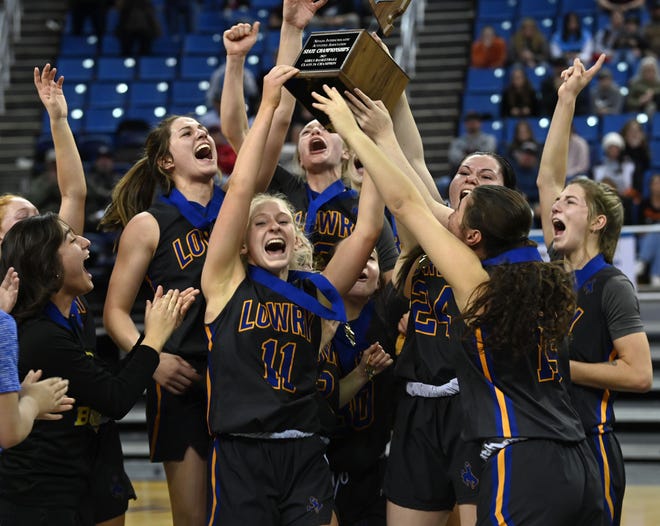 Lowry celebrates the 3A girls state championship win over Fernley at Lawlor Events Center on Feb. 25, 2023. Lowry beat Fernley 58-53.