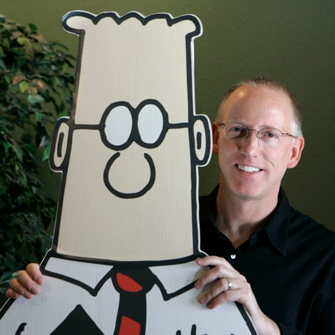 Scott Adams and his comic strip character Dilbert 