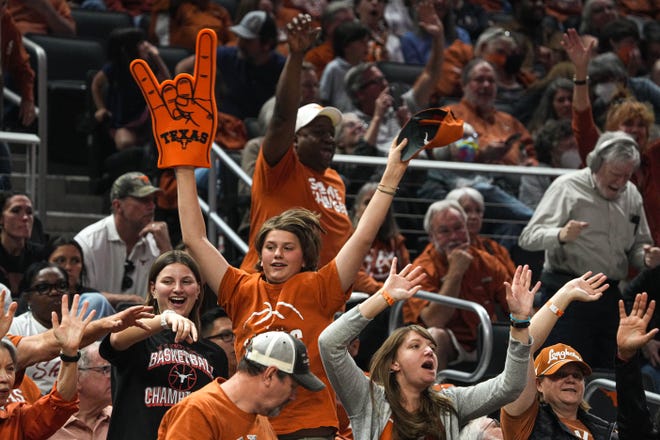 A Texas fan dances in the Moody Center stands during a Longhorns women's basketball game against Baylor on Feb. 27. The Texas women are 14-2 at Moody this season, the arena's first since replacing the Erwin Center as home court to Texas men's and women's basketball.