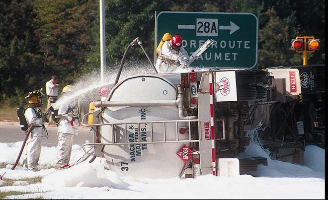 Firefighters spray foam on a tanker truck after it overturned in the Otis Rotary in Bourne on Sept. 19, 1997. About 3,000 gallons of gasoline leaked from the tanker after it crashed. The foam caused PFAS pollution. Several local organizations and the Silent Spring Institute are hosting a forum on Saturday "PFAS and Your Community" at Sturgis Charter Public School Community Center, 529 Main St., Hyannis from 1 p.m.-3 p.m.