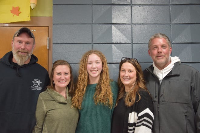 Cheboygan High School freshman Madalyn Schlak poses with her family Monday night. Schlak was named student of the month for January.