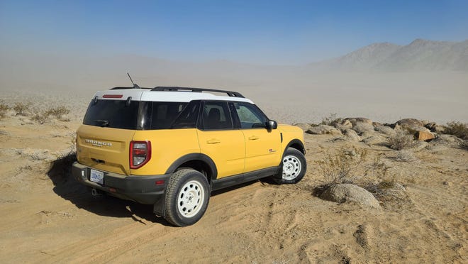 The 2023 Ford Bronco Sport Heritage Limited Edition surveys Johns Valley, California - home of the King of the Hammers off-road race. Note the mud flaps and all-terrain tires.