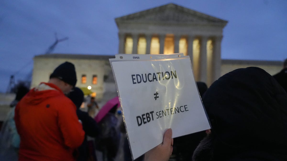 Protestors gather outside the U.S. Supreme Court on Feb. 27, 2023 in Washington, D.C., ahead of the oral arguments in two cases that challenge President Joe Biden's $400 billion student loan forgiveness plan.