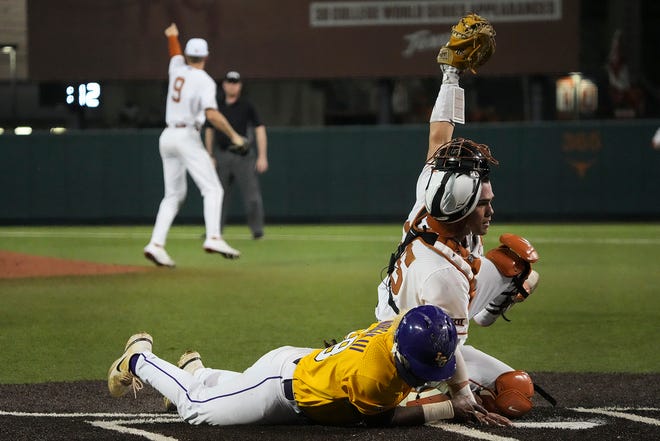 Texas catcher Garret Guillemette tags out LSU first baseman Tre' Morgan at home plate during Tuesday night's 3-0 loss at UFCU Disch-Falk Field. The unranked Longhorns and top-ranked Tigers were tied 0-0 heading into the ninth inning.