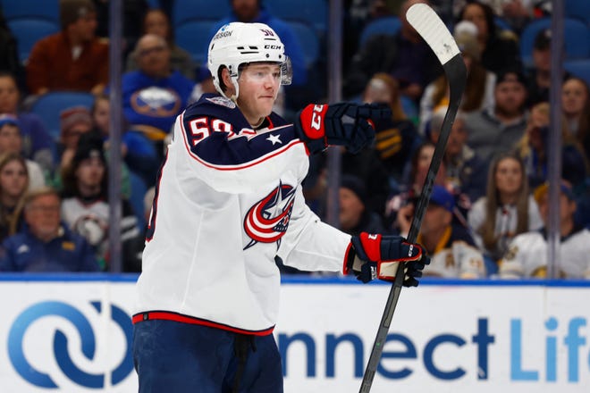 Columbus Blue Jackets left wing Eric Robinson celebrates his second goal during the second period of an NHL hockey game against the Buffalo Sabres, Tuesday, Feb. 28, 2023, in Buffalo, N.Y. (AP Photo/Jeffrey T. Barnes)