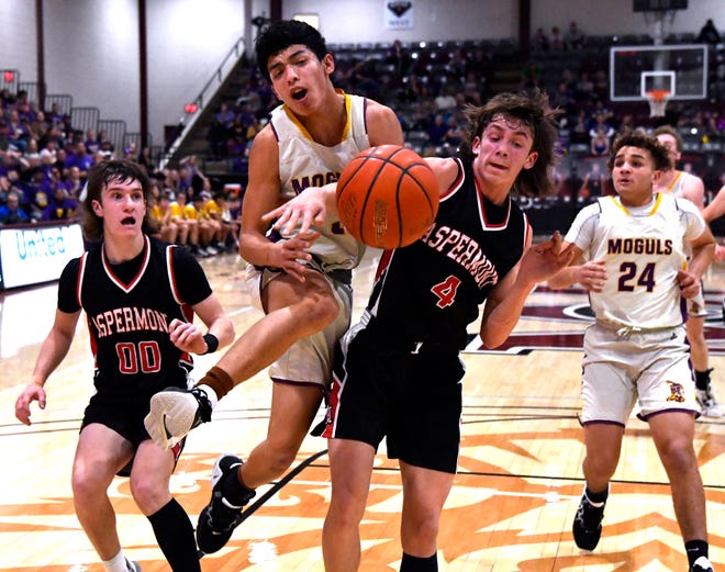 Munday's Christopher Garcia leaps past Aspermont's Kade Morris during Tuesday's Class 1A regional  quarterfinals game at McMurry University The Moguls hung on for a 50-46 win.