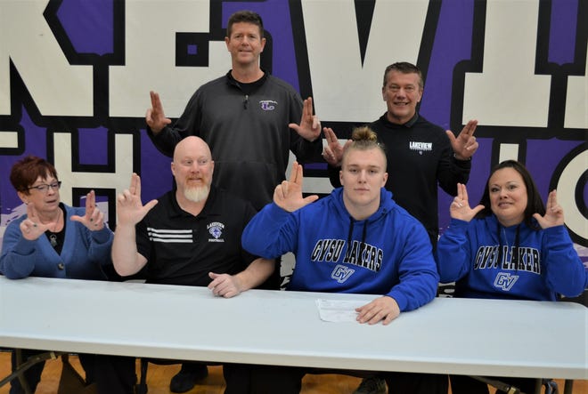 Lakeview's Andrew Berryhill committed to the Grand Valley State University men's track and field team during a signing ceremony at Lakeview High School on Wednesday. He is joined by his family and Spartan coaches.