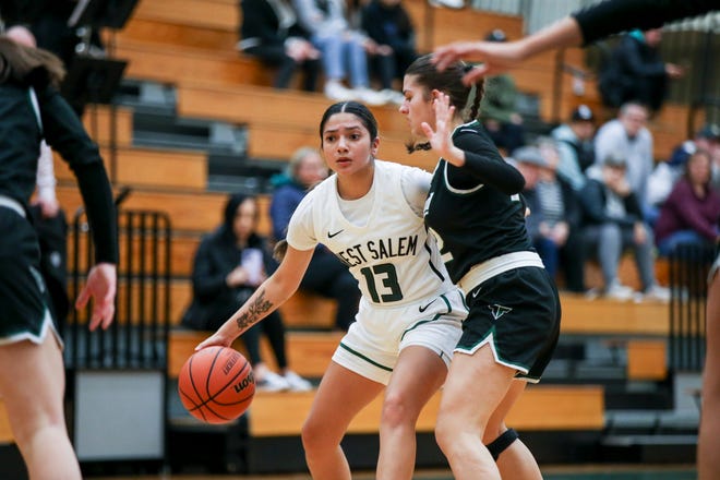 West Salem's Madelyn Diaz (13) looks for an opening  during the playoff game against Tigard on Tuesday, Feb. 28, 2023 in West Salem, Ore.