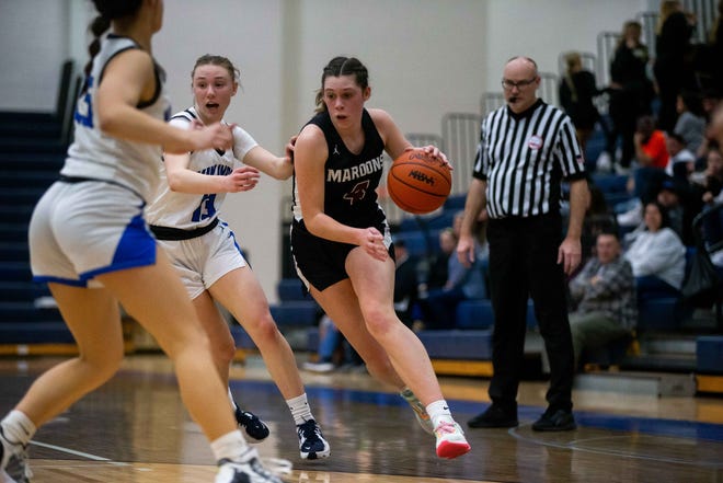 Holland Christian's Camryn VandenBosch takes the ball down the floor during a district game against Hopkins Wednesday, March 1, 2023, at Hopkins High School. 