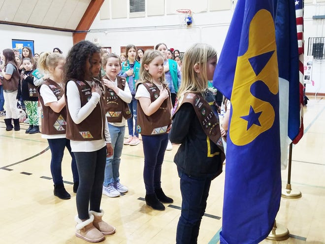 Brownie Troop 21127 conducted the flag ceremony at the recent Girl Scout International Festival.